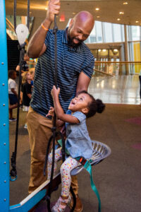 a father and daughter play at the maryland science center