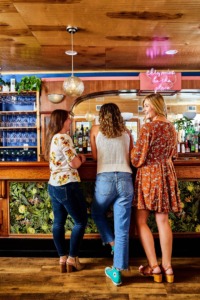 Women standing at bar