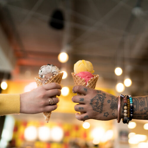 Hands holding ice cream cones