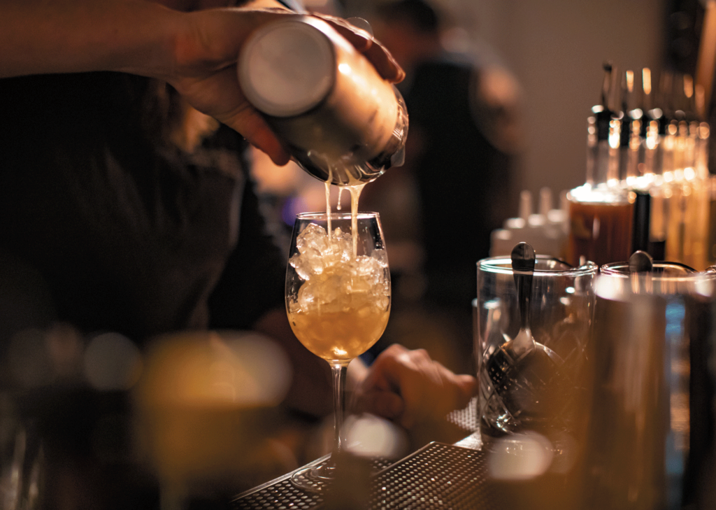 Pouring a cocktail at Old Line Spirits