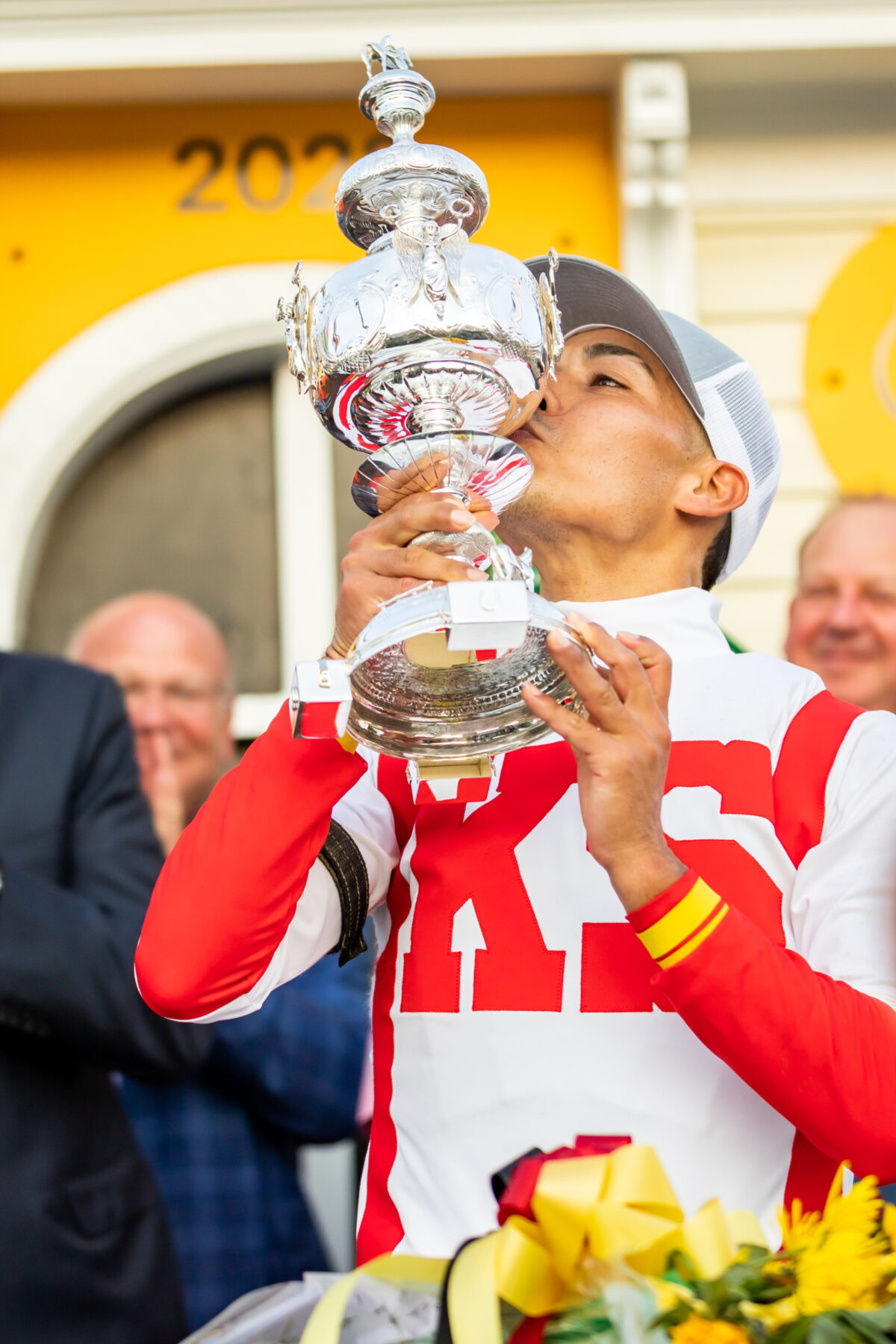 Winning jockey kisses the trophy