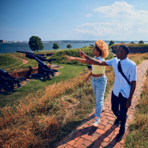Two people walk through Fort McHenry