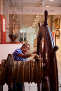 Child plays inside of Baltimore Historical Society.