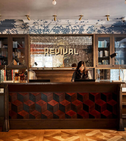 Person at check-in desk at hotel Revival in Baltimore.