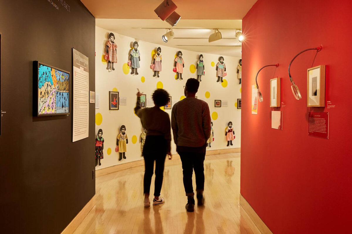 Two people look at an interior exhibition at AVAM in Baltimore.