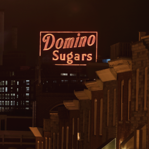The Domino Sugars sign at night from Federal Hill.