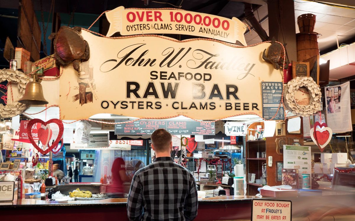 Customers ordering at Faidleys Lexington Market in Baltimore.