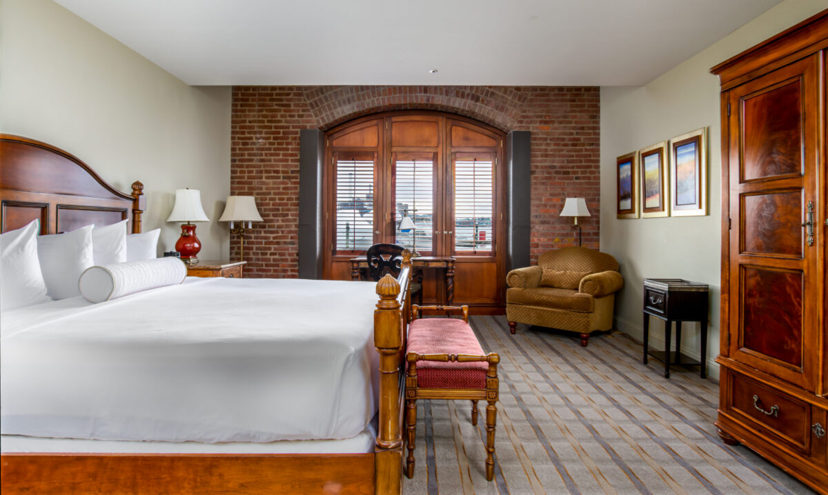 The Inn at Henderson's Wharf invites you to experience unbridled comfort in elegant rooms exuding warmth with exposed brick, Hemingingway-style furnishings, and inspiring views of the harbor, marina, or cobblestone streets