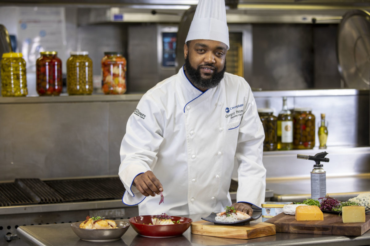 Executive chef Gregory Pittman smiles for a photo in the Centerplate kitchen