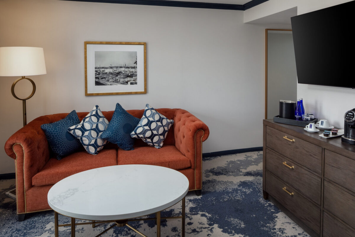 Elevate your stay in this thoughtfully designed suite at The William Fell Baltimore, Tapestry Collection by Hilton. Featuring a separate living area and private bedroom, the space offers the perfect blend of comfort and sophistication. The living area invites relaxation with stylish furnishings, warm lighting, and contemporary décor—ideal for unwinding or entertaining. The bedroom provides a serene retreat with a plush king-sized bed, premium linens, and refined finishes. With a spacious layout, modern amenities, and a distinctive sense of Baltimore charm, this suite is tailored for guests seeking a more elevated and private experience.