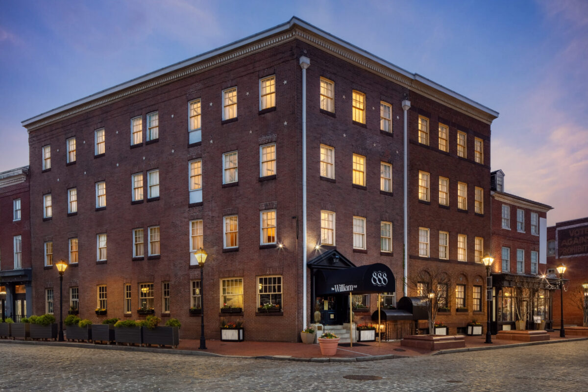 Nestled in the heart of Baltimore’s historic Fells Point, The William Fell Baltimore, Tapestry Collection by Hilton stands proudly at the intersection of Thames Street and S Broadway. The hotel’s charming exterior reflects the neighborhood’s rich heritage, offering guests an authentic Baltimore experience. Just steps away from cobblestone streets, lively waterfront views, and vibrant local culture, the hotel provides the perfect blend of historic elegance and modern comfort. Whether you're exploring the area's boutique shops, renowned eateries, or historic landmarks, the location offers unparalleled access to the best of Fells Point.