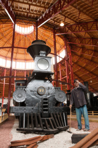 B&O No. 57 "Memnon" steam engine with a display mannequin at the B&O Railroad Museum.