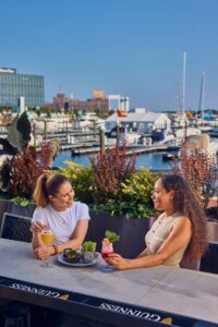 two women enjoying drinks at loch bar