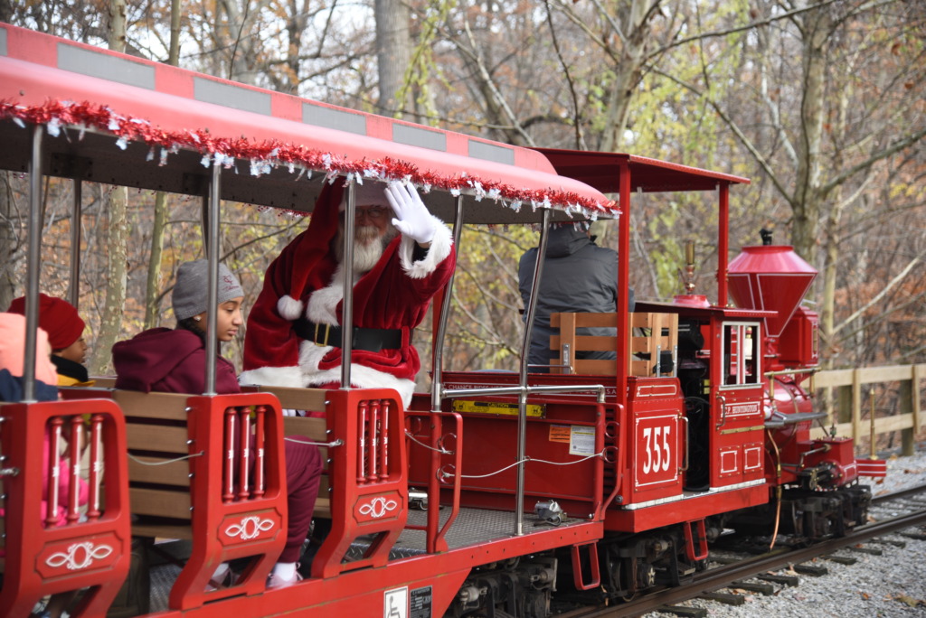 Santa riding on a red train