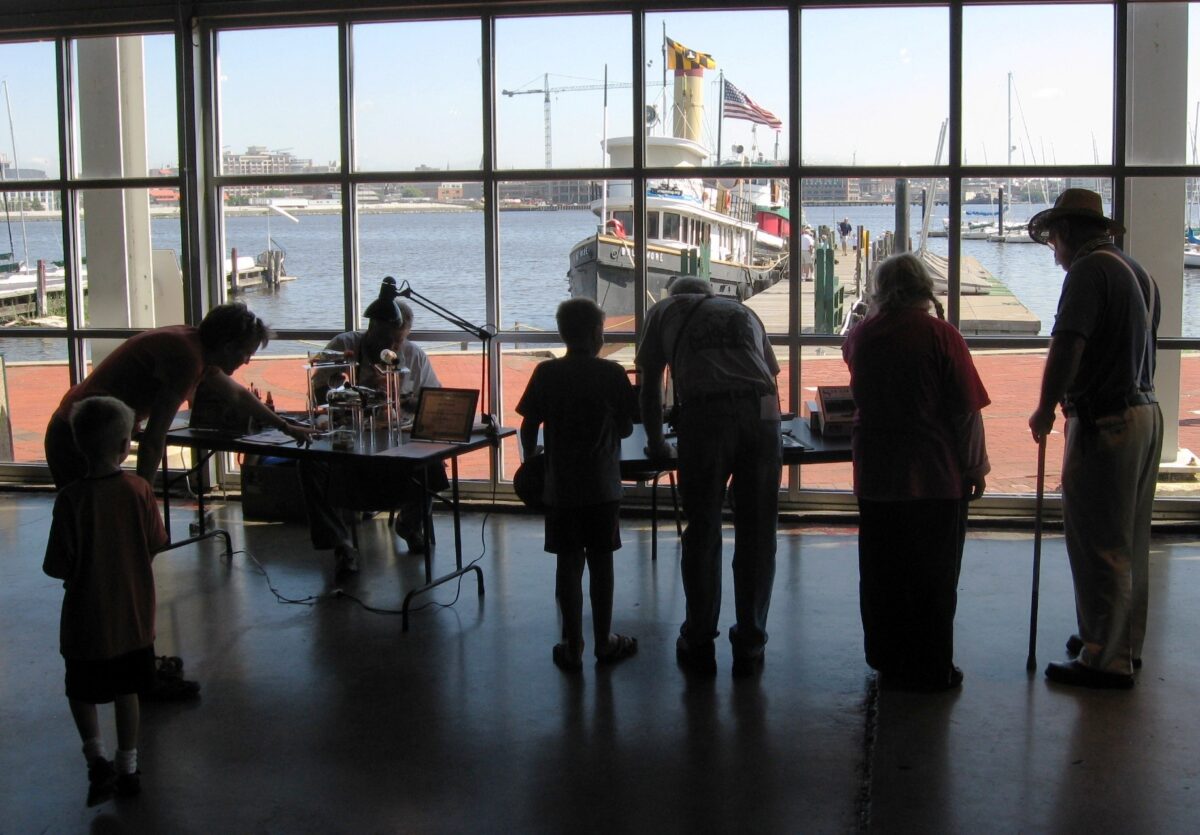 Visitors interacting with exhibits in the Museum of Industry.