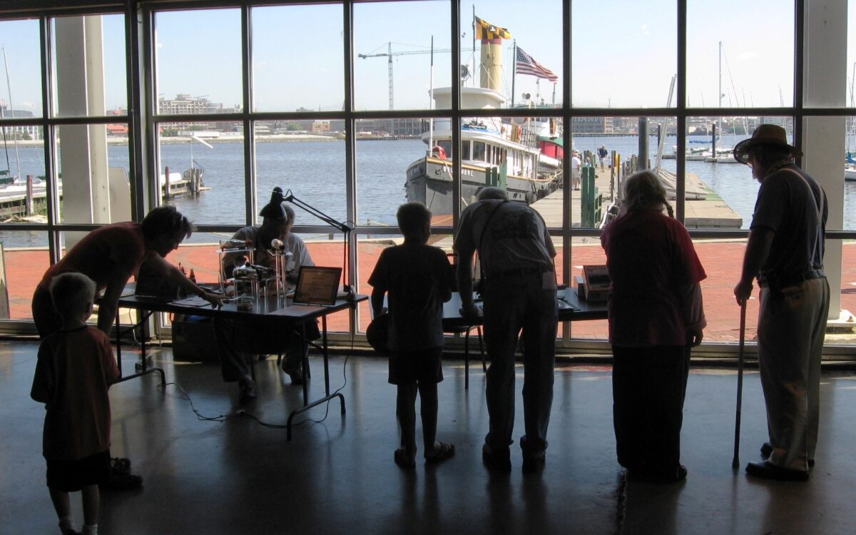 Visitors interacting with exhibits in the Museum of Industry.