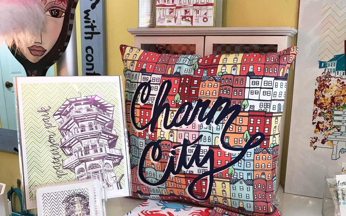 A display of towels and post cards with patterns and designs relating to Baltimore.
