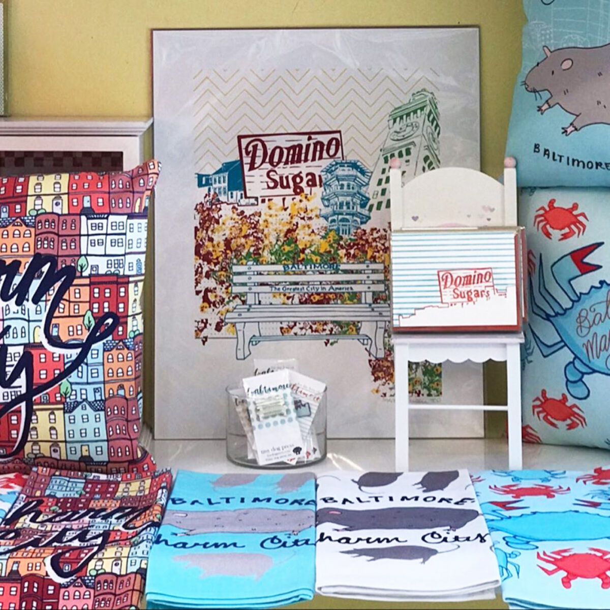 Display with towels and prints with patterns and designs relating to Baltimore.