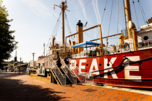 Side view of the Lightship Chesapeake in the Baltimore harbor.