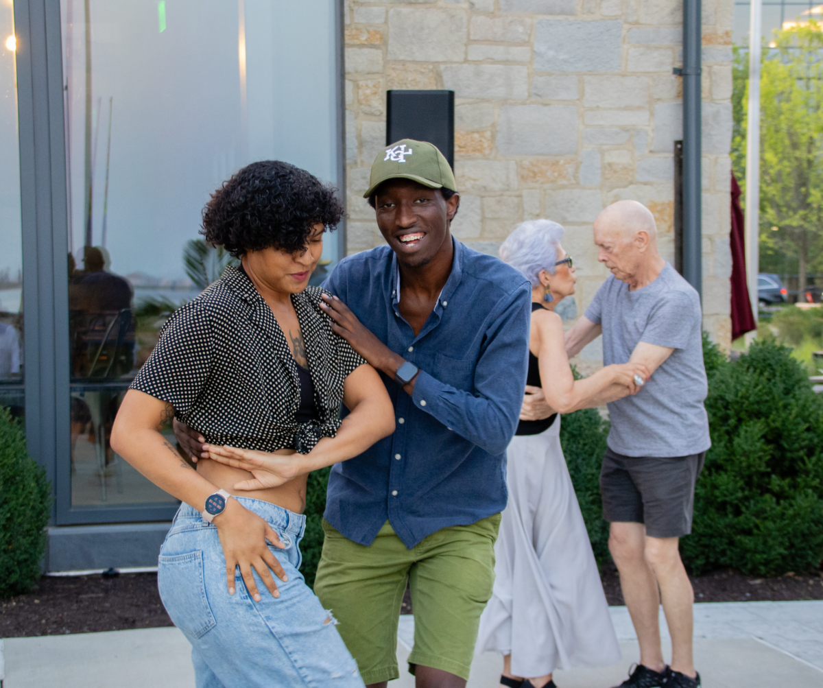 A woman and man dance together