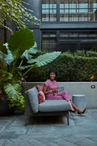 Woman sitting in courtyard