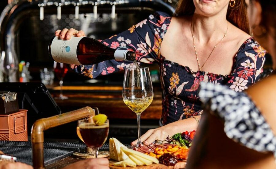 Exterior of the National Aquarium seen from the harbor at night.