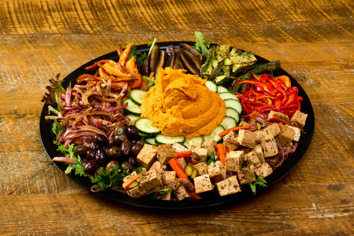 A delicious assortment of roasted vegetables, smoked hummus, and tofu salad.