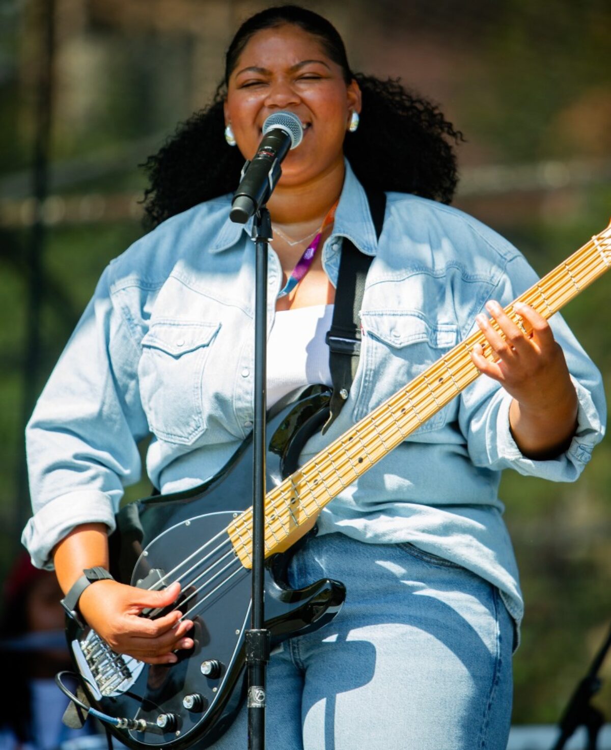 woman playing guitar and signing