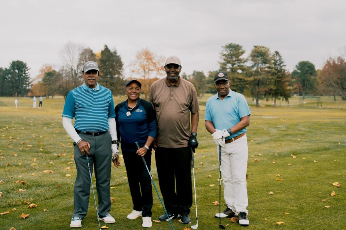 4 people golfing