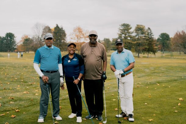 4 people golfing