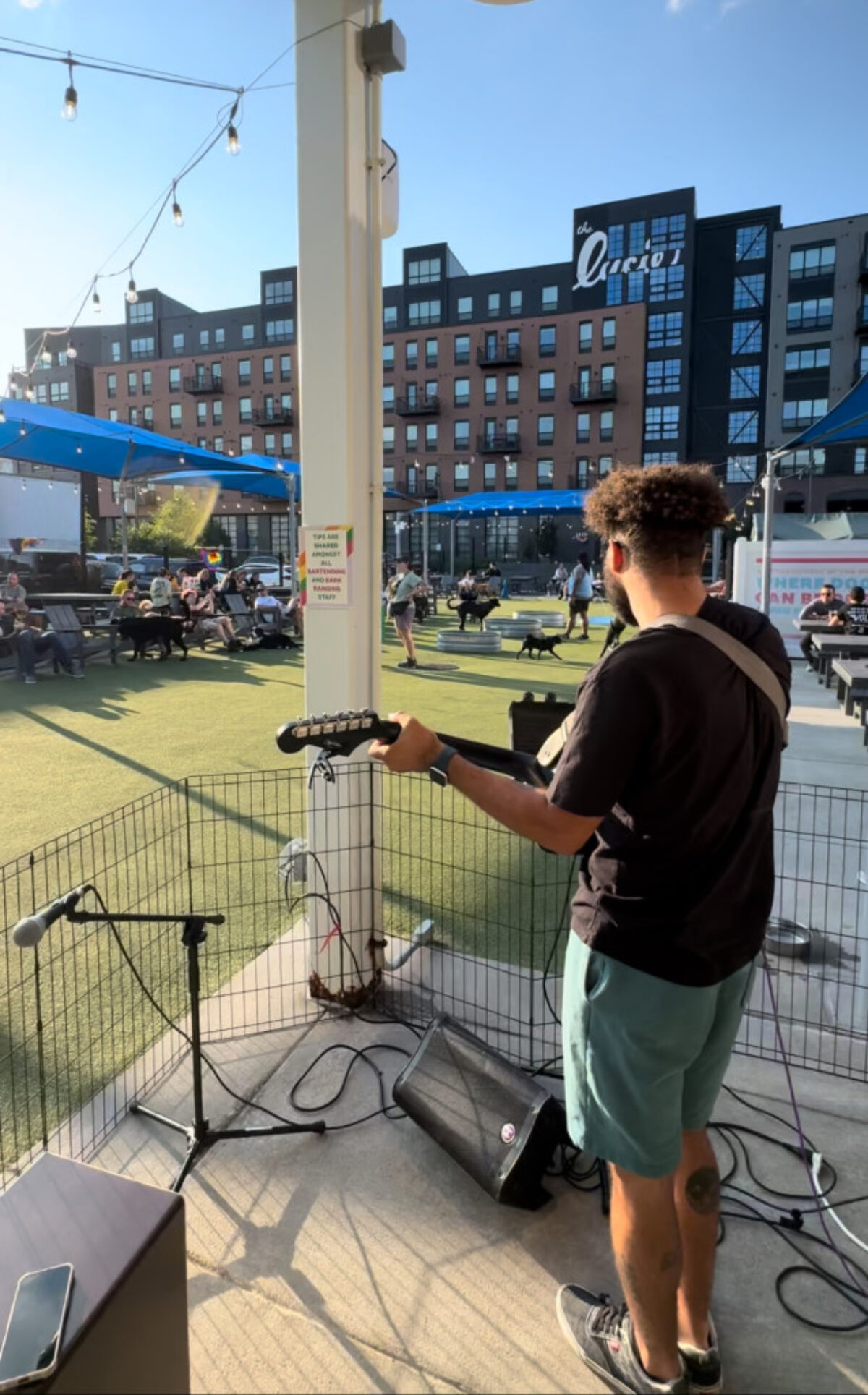 man playing guitar outside