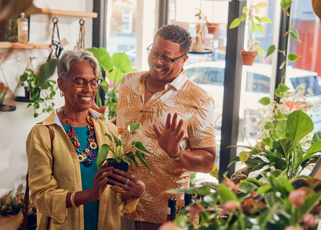 people in store with plants