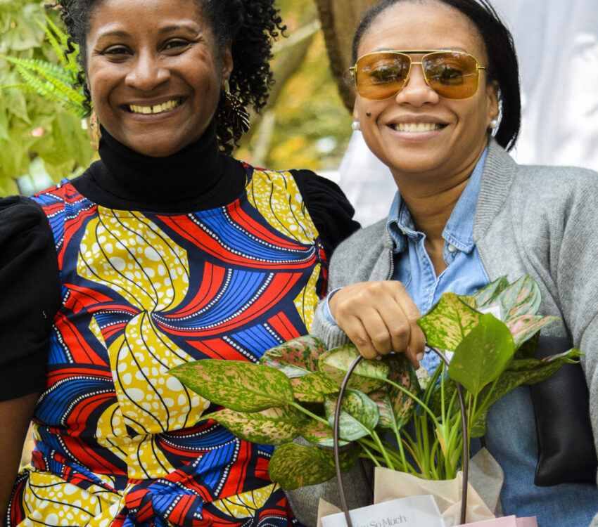 Gardenista Creations owner, Kristin Sparkman, shown with a customer at a local event where she was featured as a vendor.