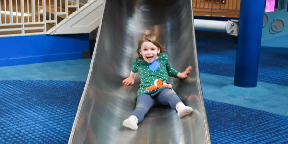 child going down a slide
