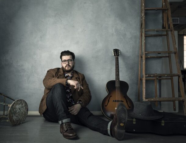 Noah Guthrie with a guitar