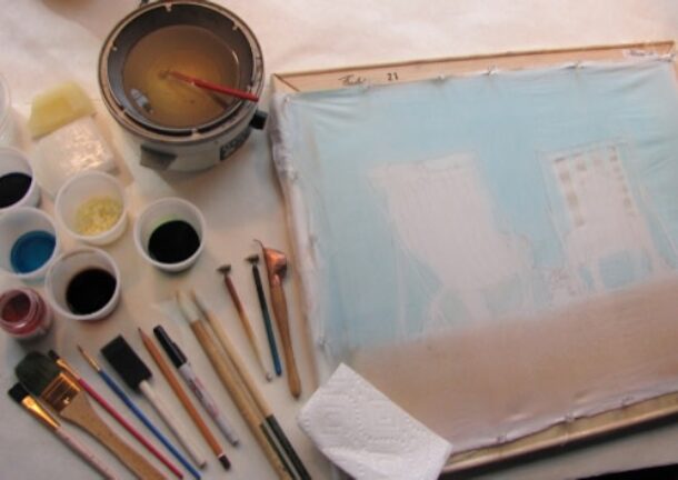 canvas, paint and paintbrushes