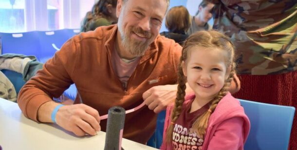 father smiling with girl