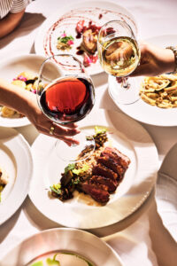 aerial shot of wine glasses and plates from Cinghiale