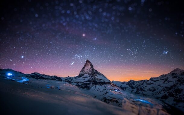 mountain peak with stars in the background
